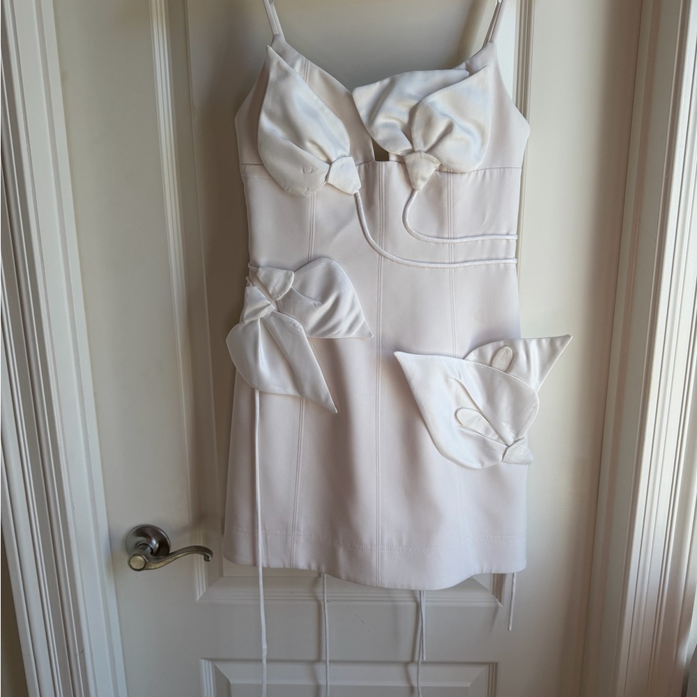 Chic White Mini Dress with Bow Accents